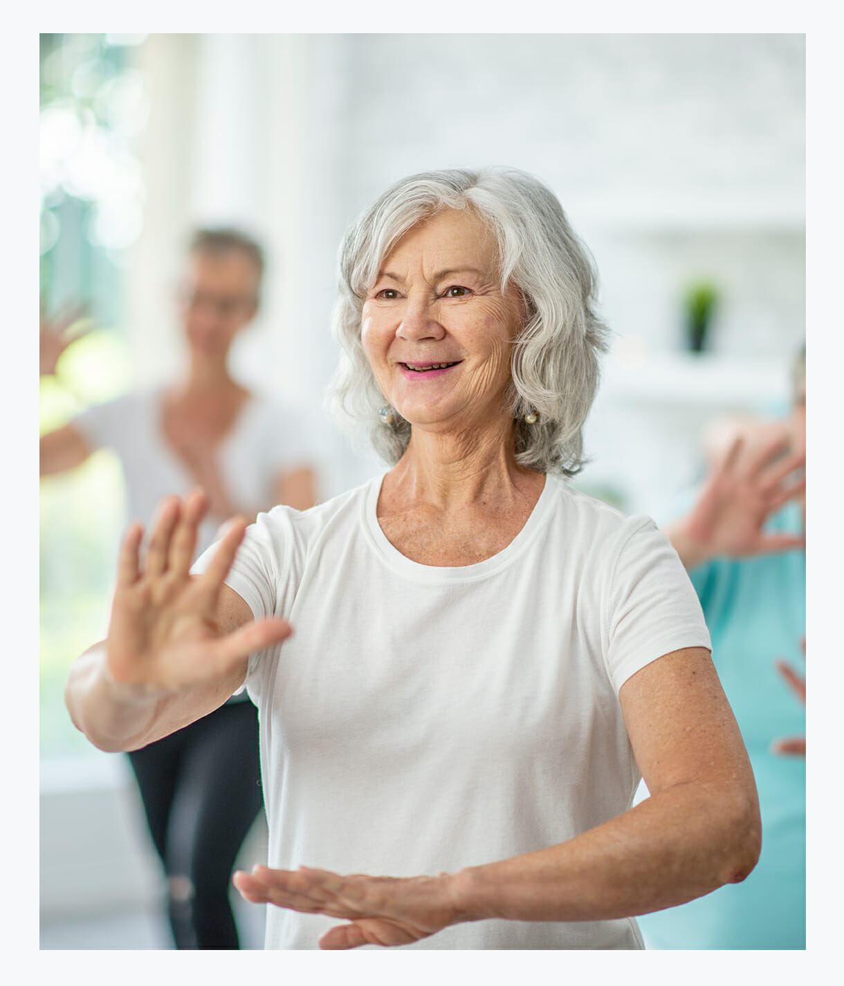 Senior woman enjoying in-home activities through Neighbor to Neighbor programs yoga tai chi reiki