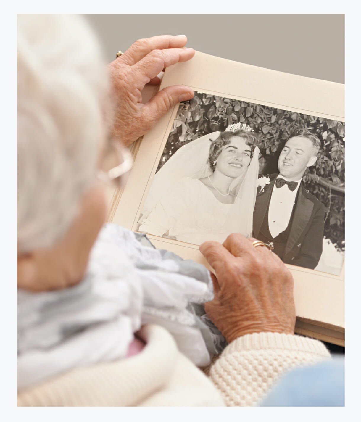 Memory Care Assisted Living resident looking at old photo, innovative memory stimulation, all-inclusive care