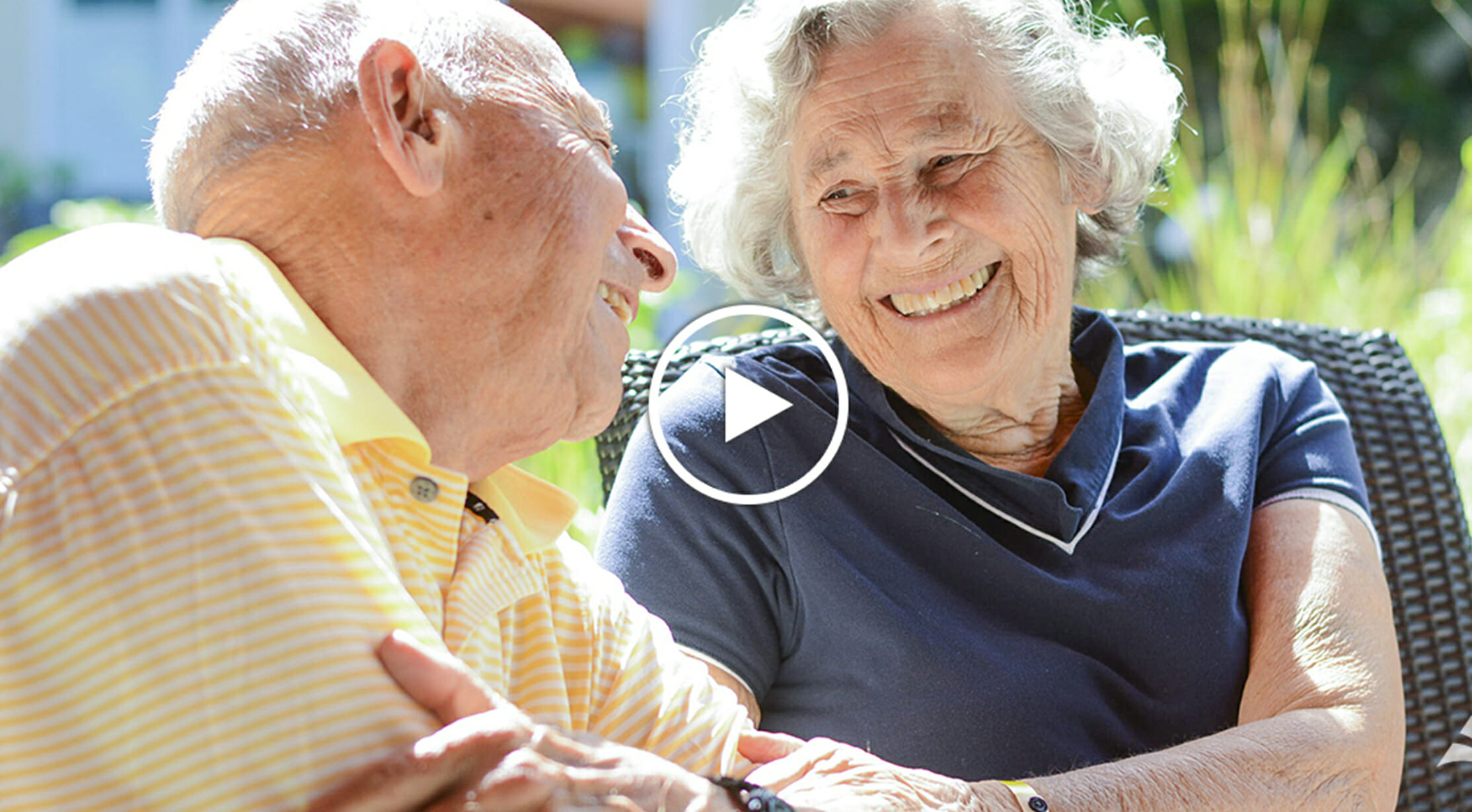 Independent living resident with Memory-Impaired spouse enjoying time together in Serenity Gardens, continuum of care