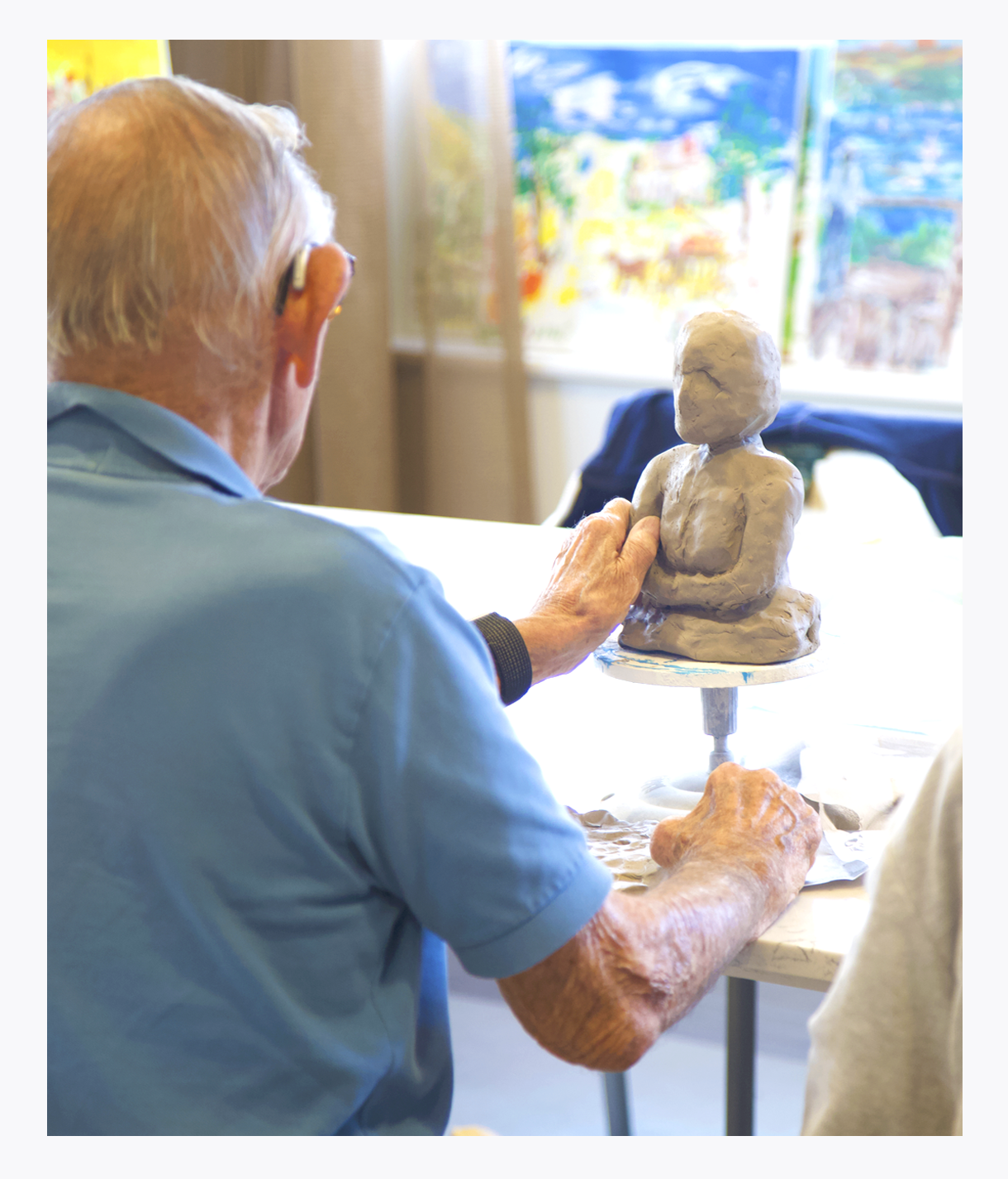 Older gentleman clay sculpting, Palliative Care Art and Music programs, comfort care, life enhancement 