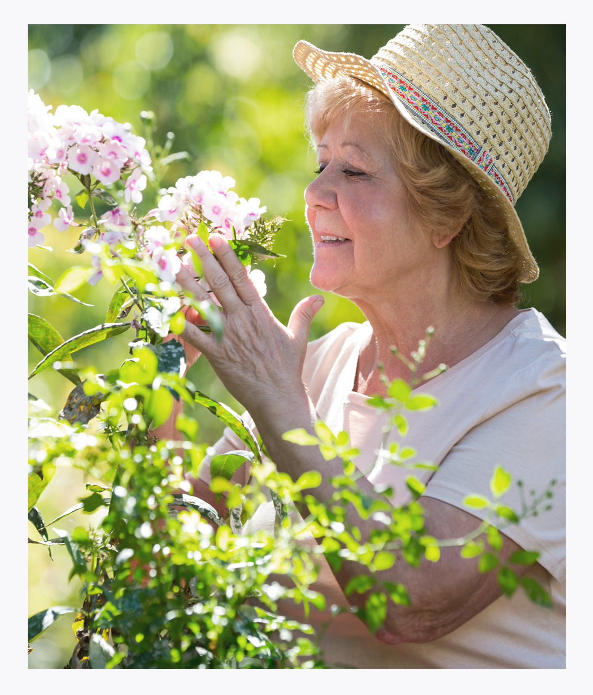 Senior woman smelling flowers, pain management, symptom management, quality of life