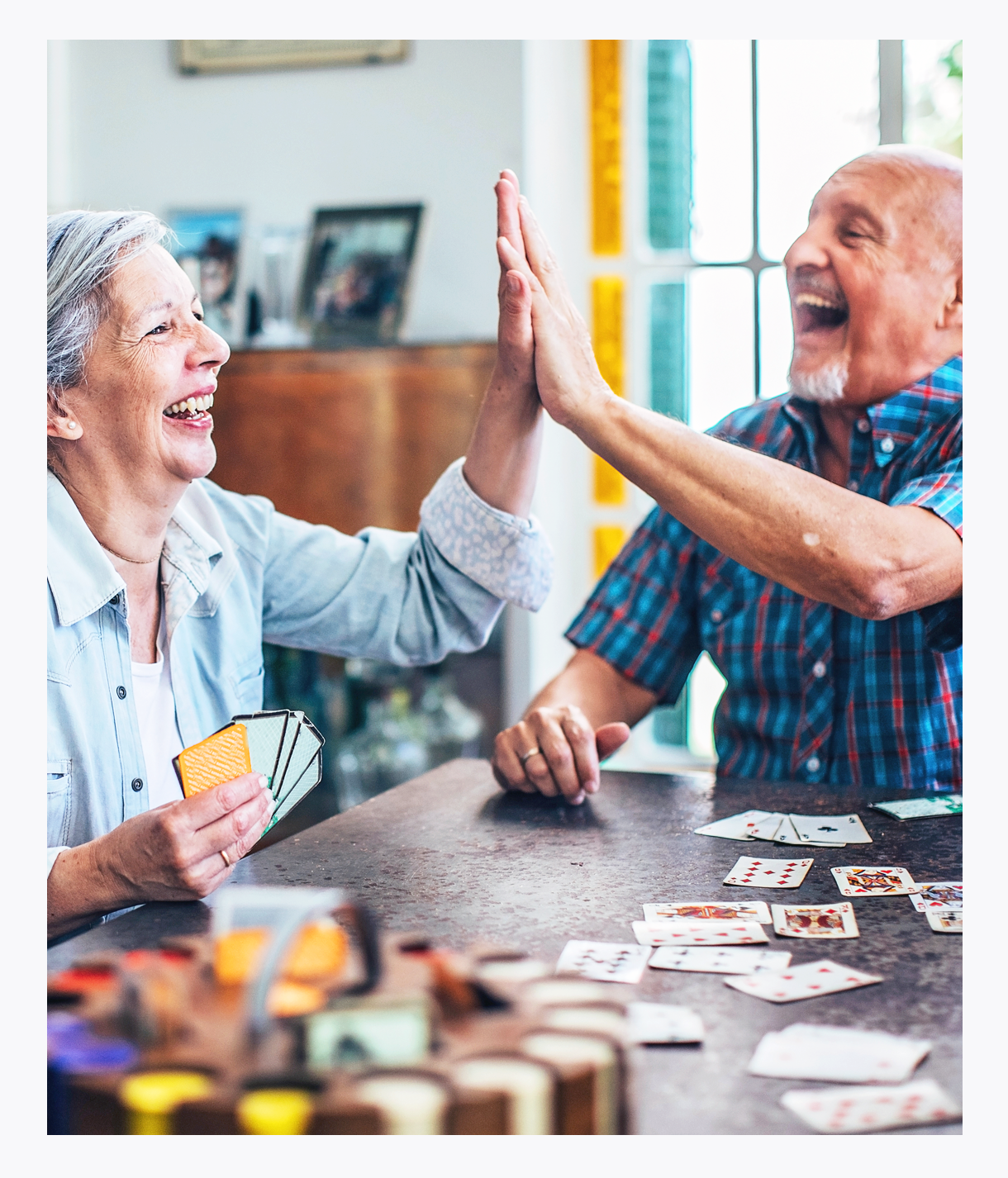 Seniors with chronic illness enjoying high-stakes card game, celebrating life, More Life, pain management, laughter is the best medicine